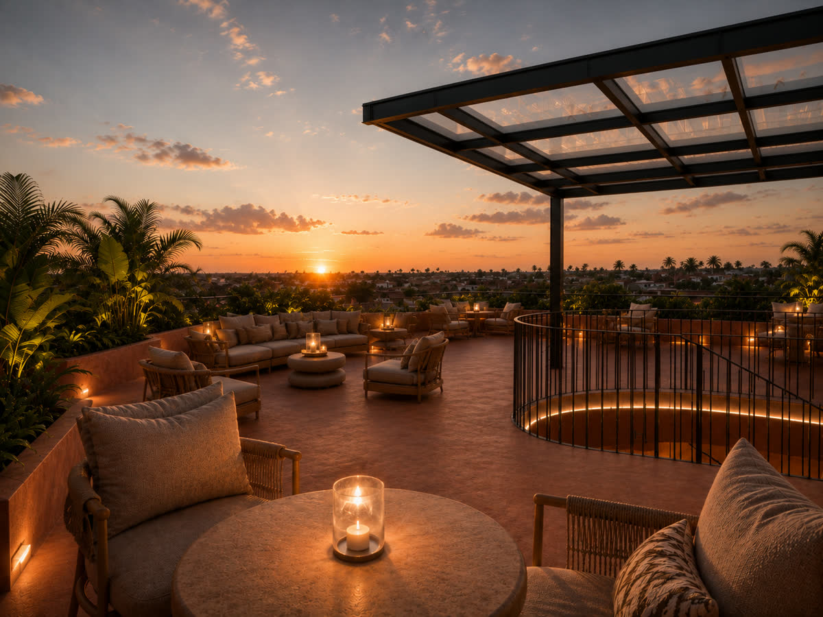 Rooftop lounge terrace with day beds and a plunge pool, set for sunset